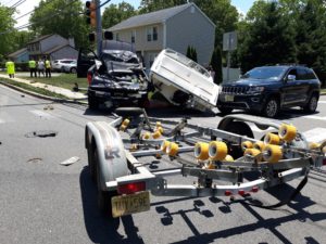 Five Treated for Minor Injuries in Truck vs. Truck vs. Boat Crash