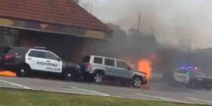 Watch as nj police officer pushes burning car to save taco bell restaurant