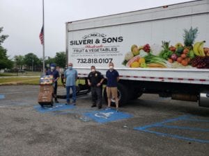 Mv silveri & sons donates food to help feed those in need in toms river