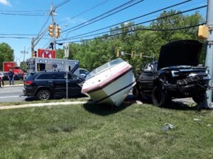 Five treated for minor injuries in truck vs. Truck vs. Boat crash