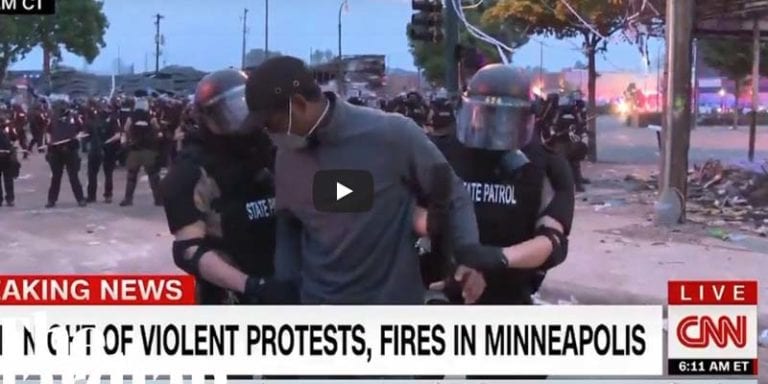 Cnn camera crew arrested on live tv after defying police order to relocate - photo licensed by shore news network.