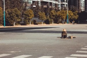 Disoriented woman smoking in middle of road coughs her coronavirus at police officers