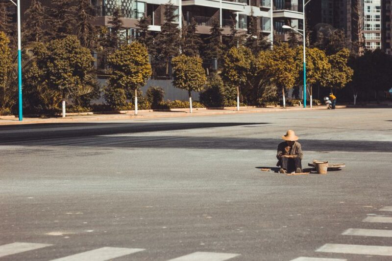 Disoriented Woman Smoking in Middle of Road Coughs Her Coronavirus at Police Officers