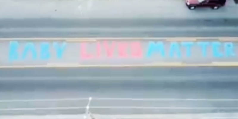 Artist Paints "Baby Lives Matter" on road in front of Planned Parenthood Offices