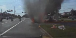 Watch: driver pulled from burning car in new jersey