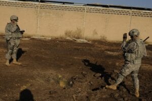 Two charged with bribery related to iraq contracts