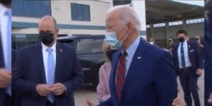 Watch as jill biden socially distances joe biden from reporters