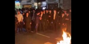 Orthodox jewish residents in brooklyn burn masks to protest cuomo plan to limit religious services