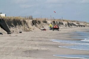 Oil spill of unknown origin in delaware bay sends barrels of oil to state's beaches