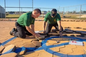 Escambia cadets chip in to repair damage from hurricane sally at nep ball park