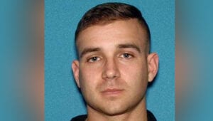 Rutgers university police officer pointed gun at his roommate "turn the volume down" on tv