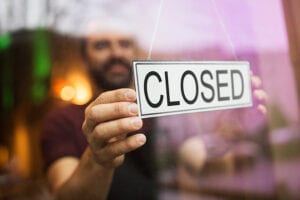 Closed sign at a small business.