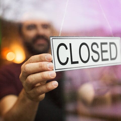 Closed sign at a small business.
