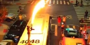 Watch: man jumps on new york city bus with flamethrower