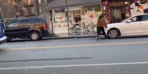 Road rage incident ends badly as car runs over man, drives through storefront window
