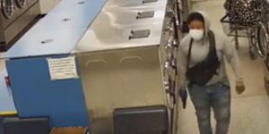 Watch: armed gunmen shoot their way into a philadelphia laundromat