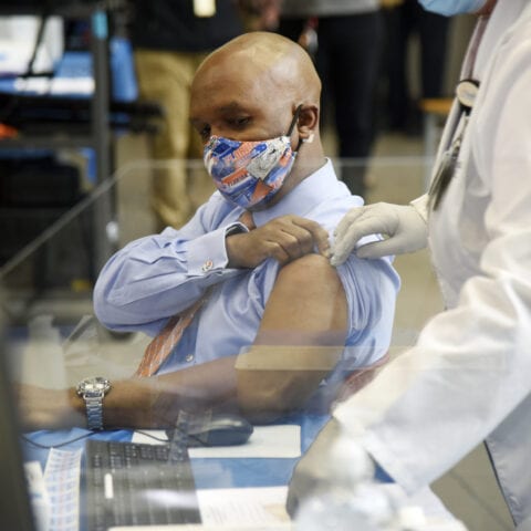 Uf doctor is first in florida to get covid-19 vaccine - photo licensed by shore news network.