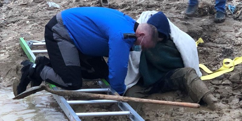 Boy rescued after being stuck in mud up to his waist