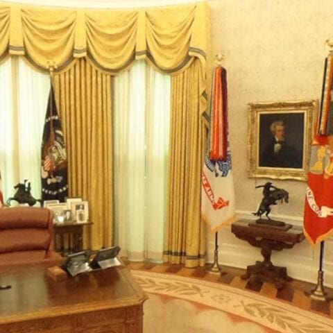 In joe biden's oval office, flags of the armed services are gone after redesign - photo licensed by shore news network.