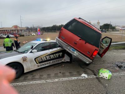 Driver crashes into Dallas sheriff's department vehicle stopped for crash