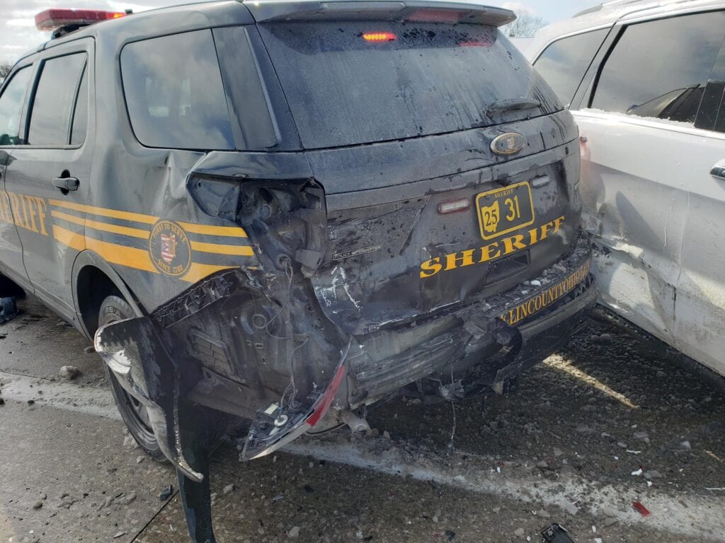 Driver going too fast, slams into police vehicle responding to previous crash