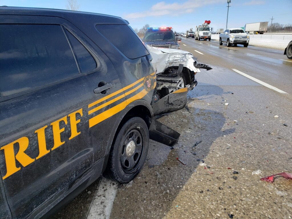 Driver going too fast, slams into police vehicle responding to previous crash