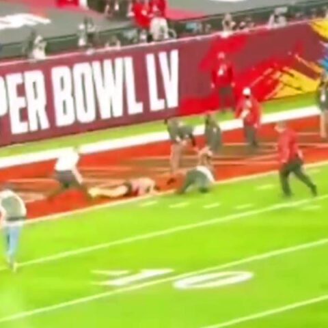 Watch: fan on field during super bowl lv absolutely crushed by sheriff's deputies at the goal line - photo licensed by shore news network.