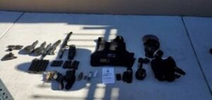 While wearing body armor and holding a handgun and machete, las vegas man paced outside of an airport business, prompting 911 calls