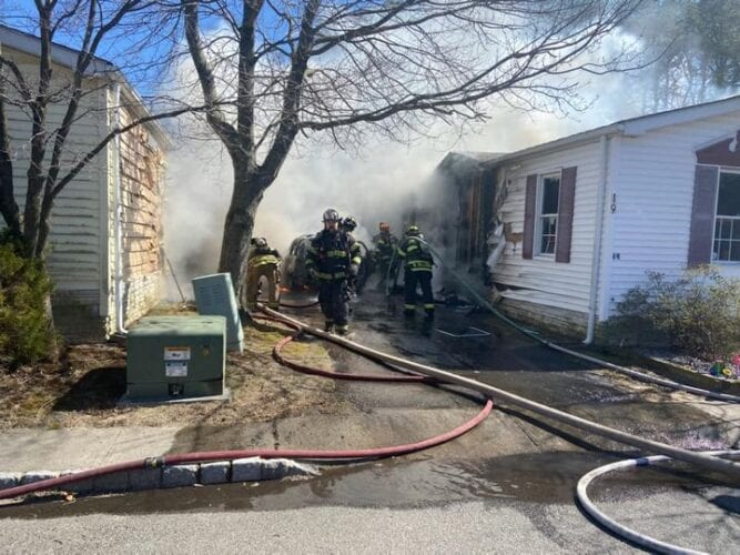 Howell firefighters battle house fire in Oak Hill