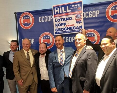 July 2019: Toms RIver Mayor Mo Hill poses with his council candidates and campaign supporters after 2019 election victory.
