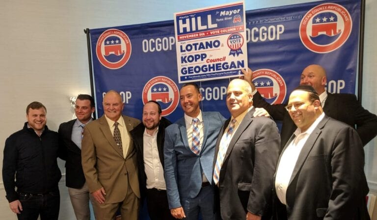 July 2019: toms river mayor mo hill poses with his council candidates and campaign supporters after 2019 election victory.