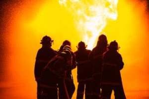 Fire fighters putting out fire - File PHoto