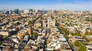 Row houses churches parks and businesses exhist in the expansive city of Baltimore