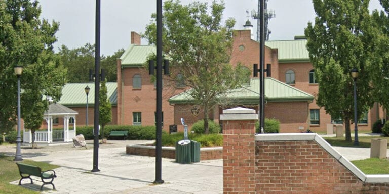 Jackson police say man acting "frenzied" ran through police hq biting cops, threatened to defecate on them - photo licensed by shore news network.