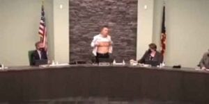 Asian councilman took off his shirt during town hall meeting to show how american he is