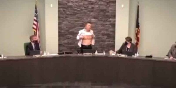 Asian councilman took off his shirt during town hall meeting to show how American he is