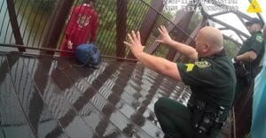 Video of orange county sheriff's deputies talking down man jumping from bridge gets 10 million views
