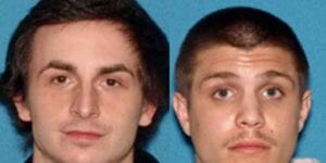Two charged for making threatening phone calls to brick police
