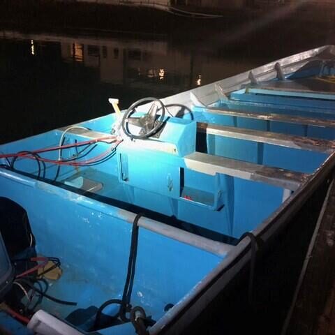 Border agents intercept overcrowded dingy at sea full of illegal immigrants - photo licensed by shore news network.