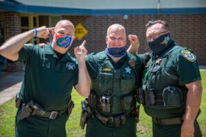 Alachua school resource deputies shave heads after losing a friendly wager