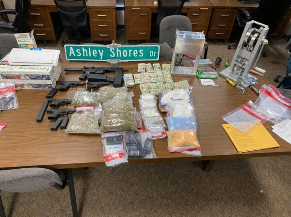 Huge cache of guns, drugs, seized in Charleston