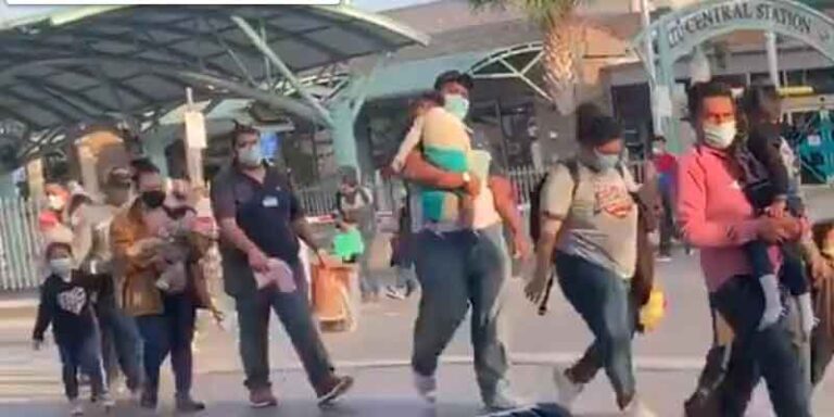 Watch: migrants released into texas town after being released by border patrol agents - photo licensed by shore news network.