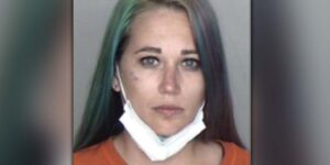 Woman charged with hate crime after trying to run over african-american worker, while shouting racial slurs