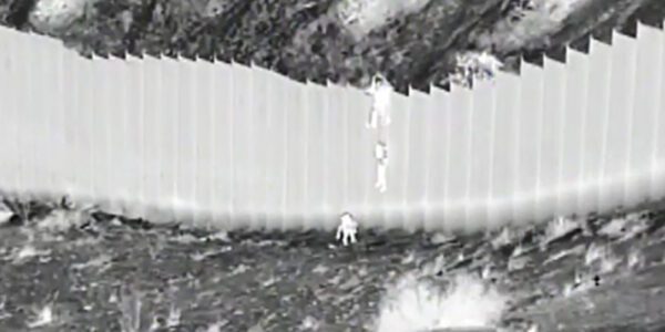 Cruel and Horrific: Watch as Human traffickers drop toddlers from 14-foot high border wall, abandon them in desert