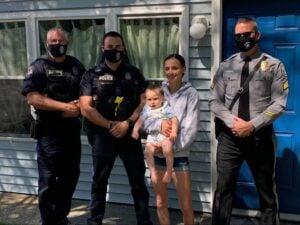 Luckily these cops were at the donut shop when a woman came in with her distressed baby