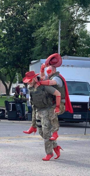 Why are these cops wearing red high heels? Why are these cops wearing red high heels?