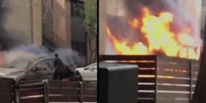 Watch as two cops risk their lives to save man trapped in burning car