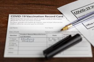 Two defendants charged in separate, covid-19 vaccination record card frauds