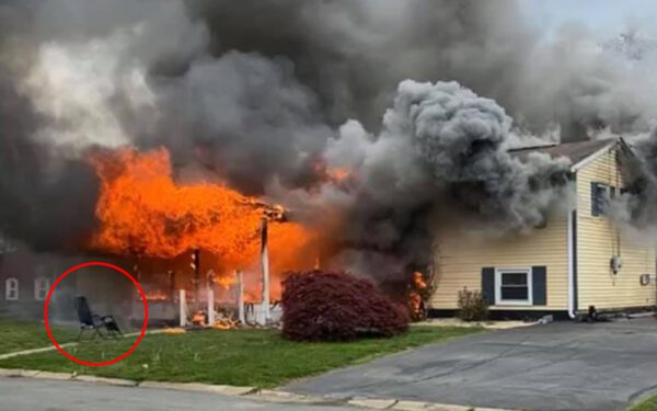Woman set her house on fire with person inside, then sat in lawn chair and watched - photo licensed by shore news network.