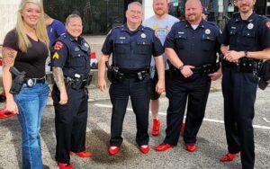 Why are these cops wearing red high heels?
